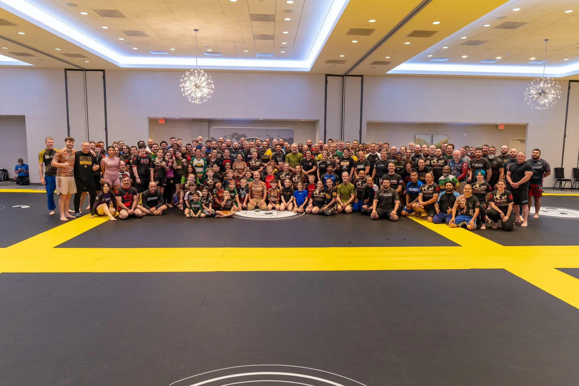 The full Summit assembled across the ballroom mat for a group photograph
